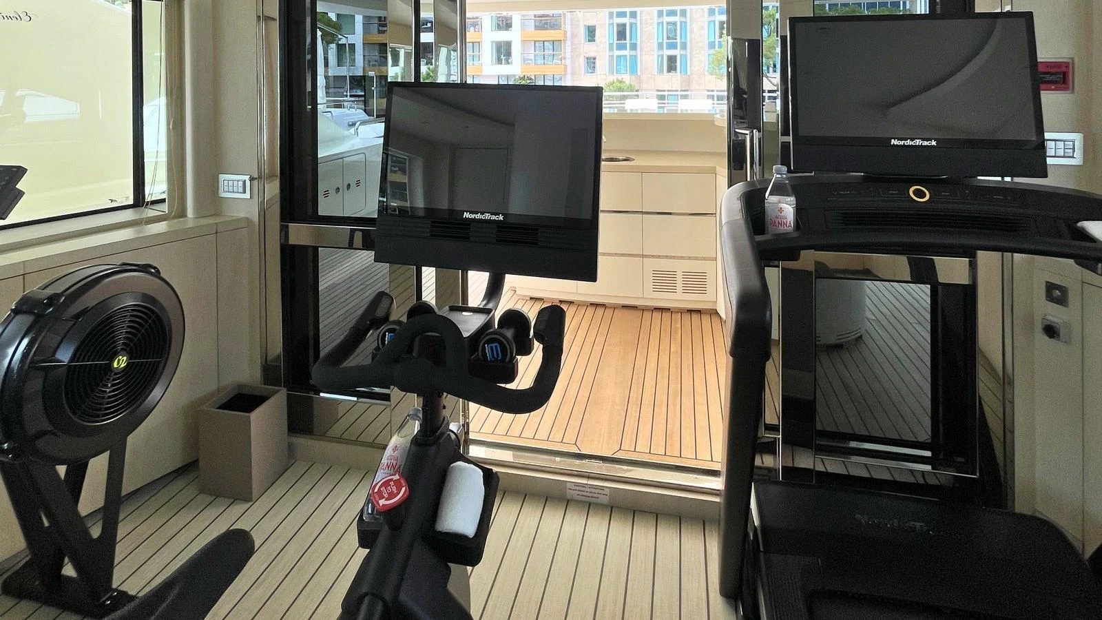 The yacht features a well-equipped gym with modern exercise machines. aboard ELENI 60M Yacht for Sale