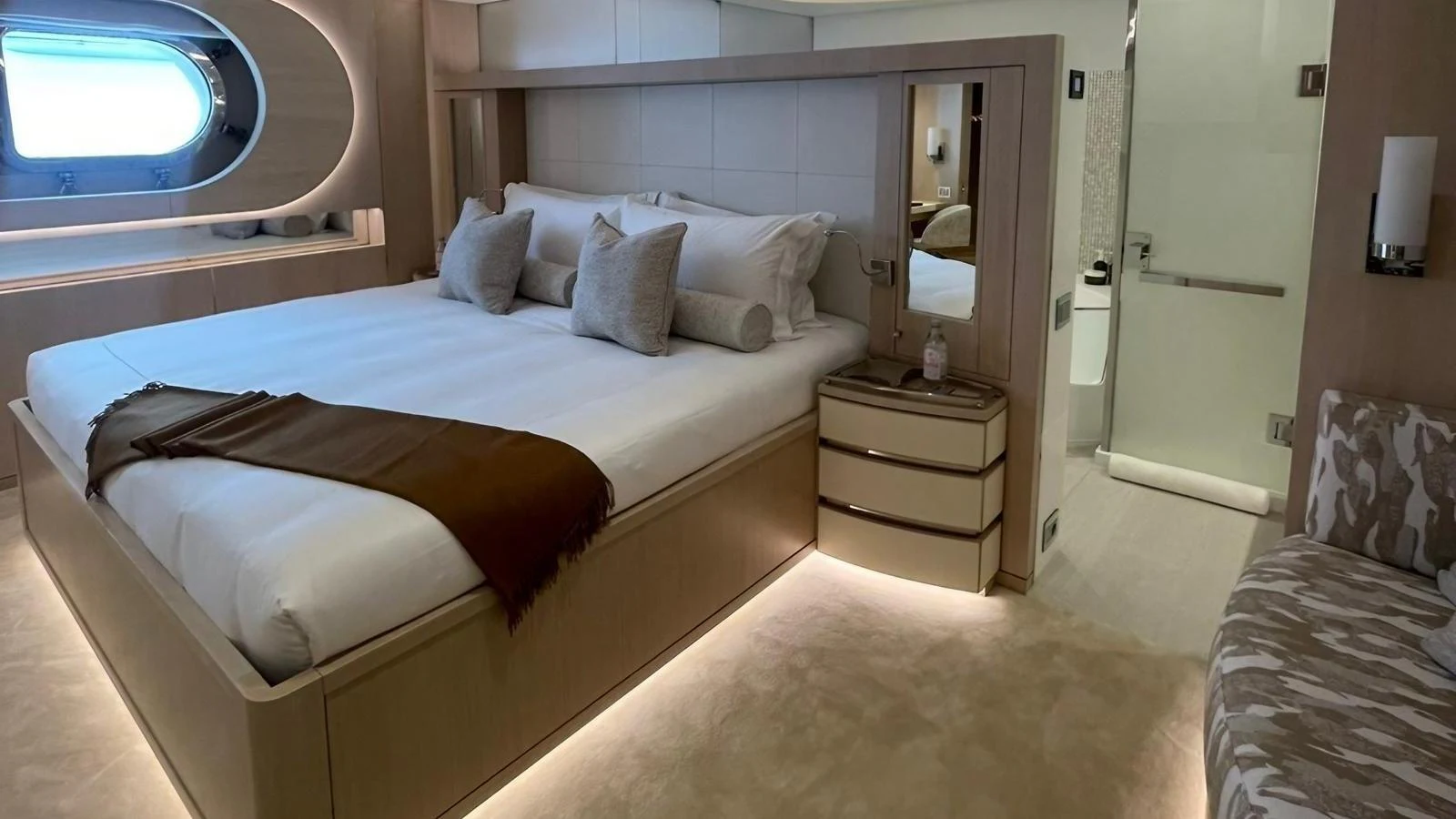 The master stateroom features a luxurious bed with elegant decor and ambient lighting. aboard ELENI 60M Yacht for Sale