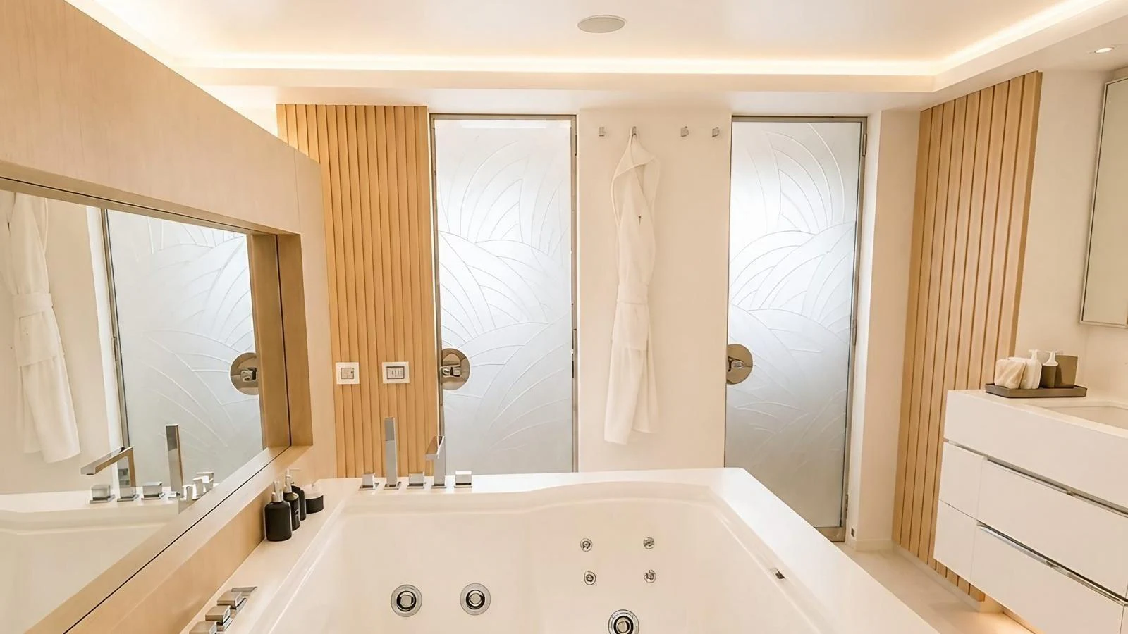 The yacht's bathroom features a luxurious jacuzzi tub and modern fixtures. aboard ELENI 60M Yacht for Sale