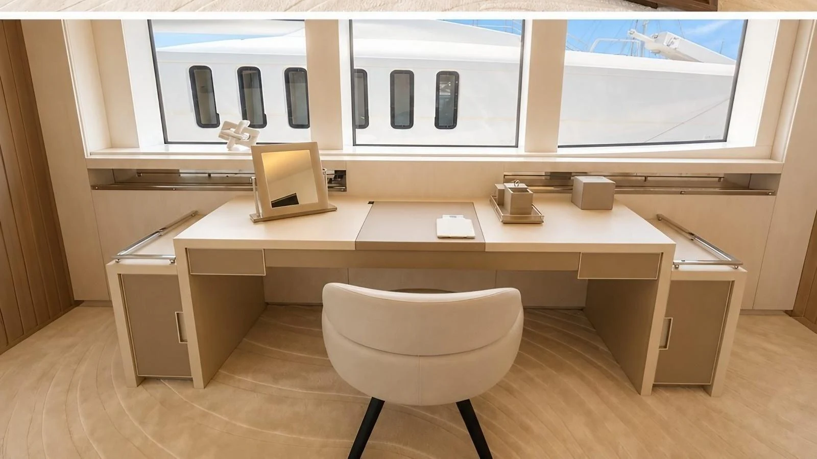 The yacht features a sleek and modern office space with a large desk and comfortable chair, perfect for work or study. aboard ELENI 60M Yacht for Sale