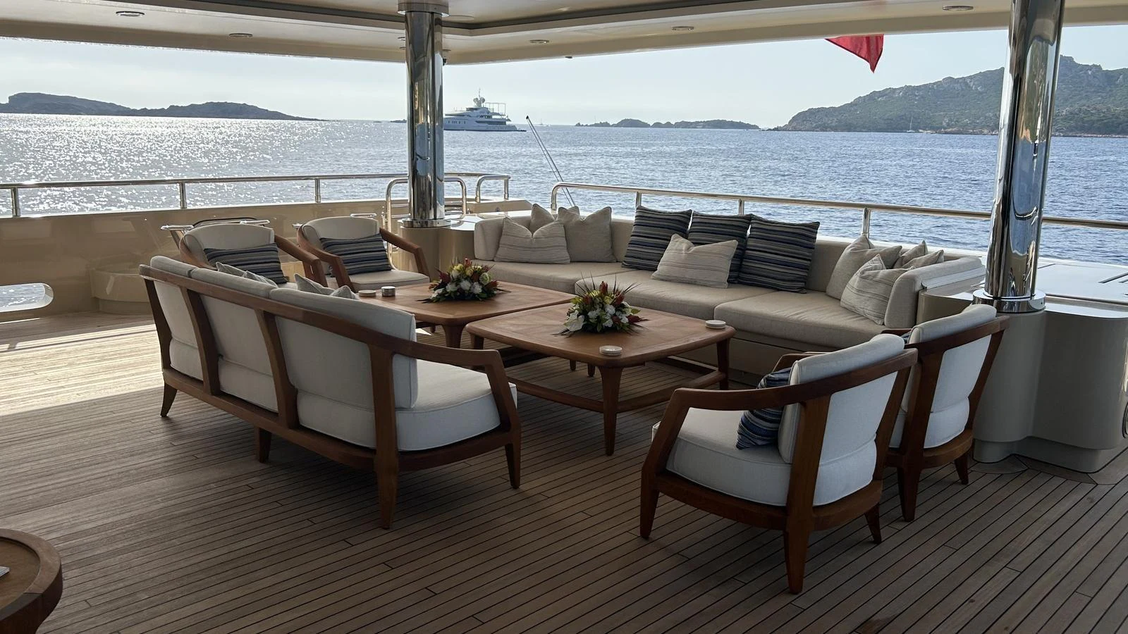The aft deck features elegant seating with a stunning ocean view. aboard ELENI 60M Yacht for Sale