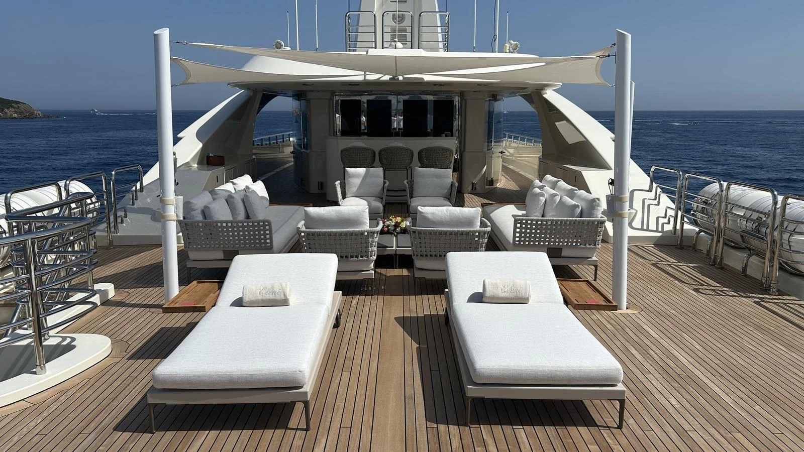 The sundeck offers luxurious lounging with sunbeds and shaded seating areas, perfect for relaxation. aboard ELENI 60M Yacht for Sale