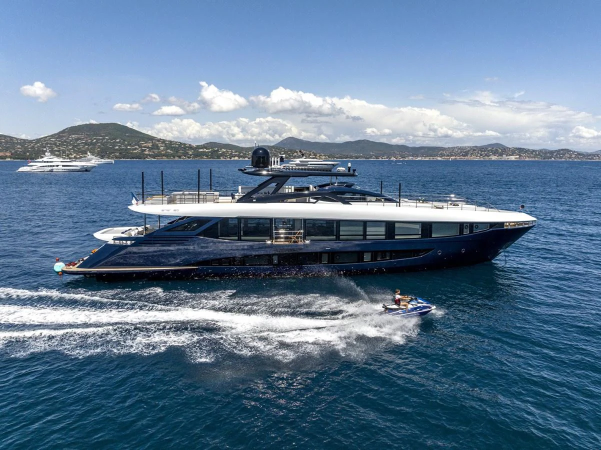 A sleek and modern yacht cruises through calm blue waters, showcasing its elegant design and luxurious amenities. aboard AMER 120/11 Yacht for Sale