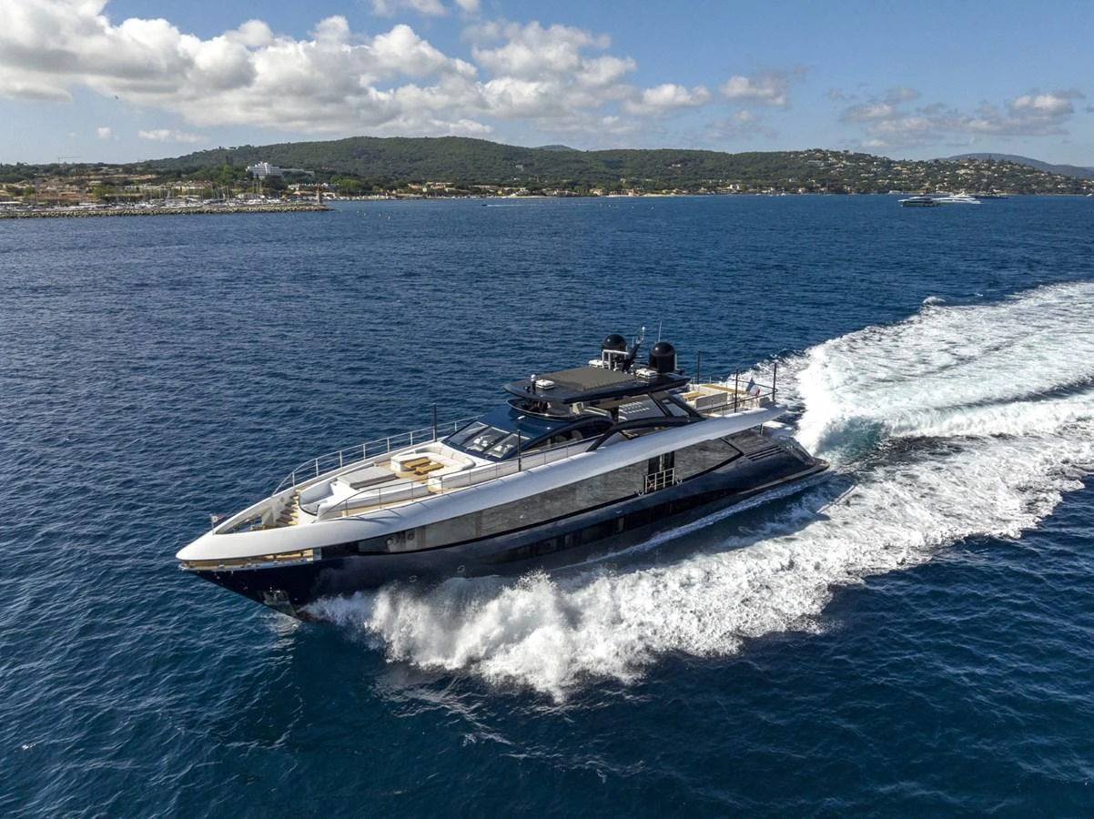 A sleek yacht cruises through the open water, showcasing its modern design and powerful performance. aboard AMER 120/11 Yacht for Sale