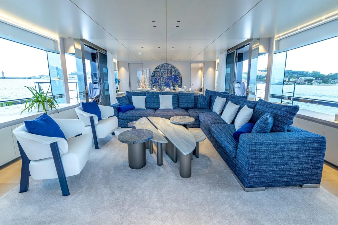 The salon features a spacious and luxurious seating area with panoramic views. aboard AMER 120/11 Yacht for Sale