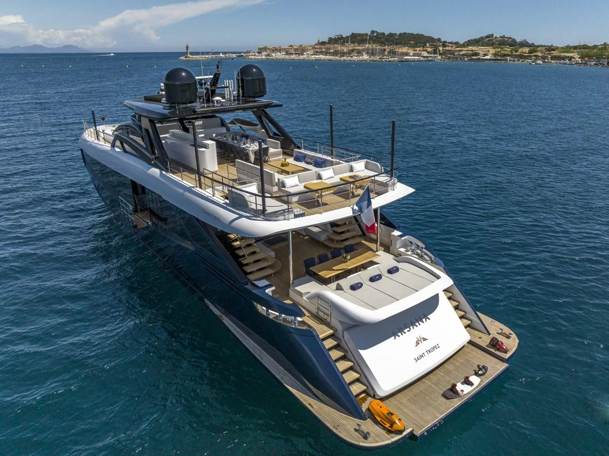 A luxurious yacht anchored in calm waters, showcasing its spacious aft deck and sleek design. aboard AMER 120/11 Yacht for Sale