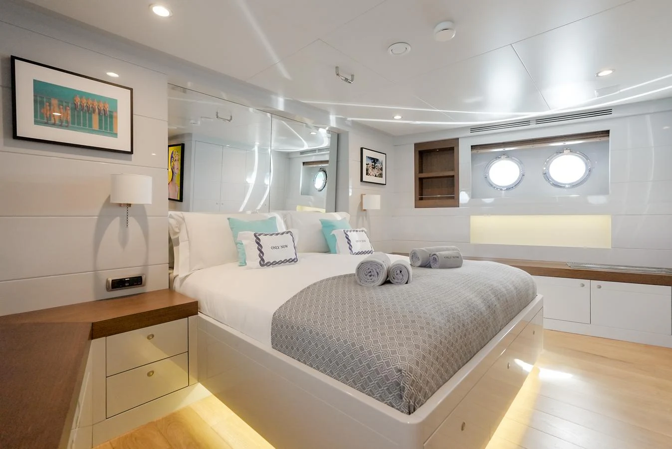 The stateroom features a comfortable bed with elegant decor and ample natural light. aboard ONLY NOW Yacht for Sale