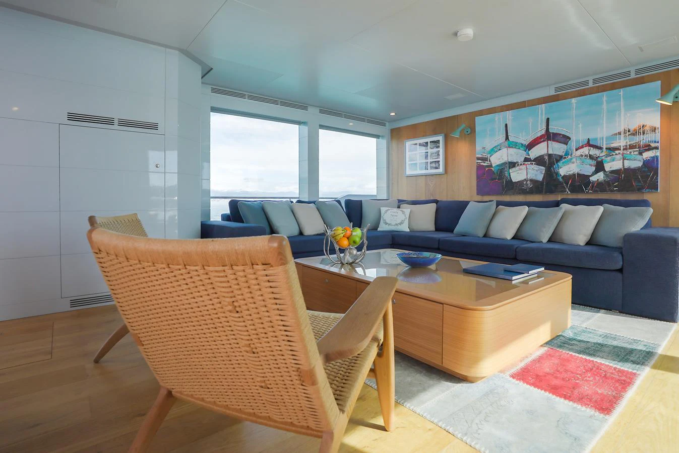 The salon features a comfortable seating area with a modern design and ample natural light. aboard ONLY NOW Yacht for Sale