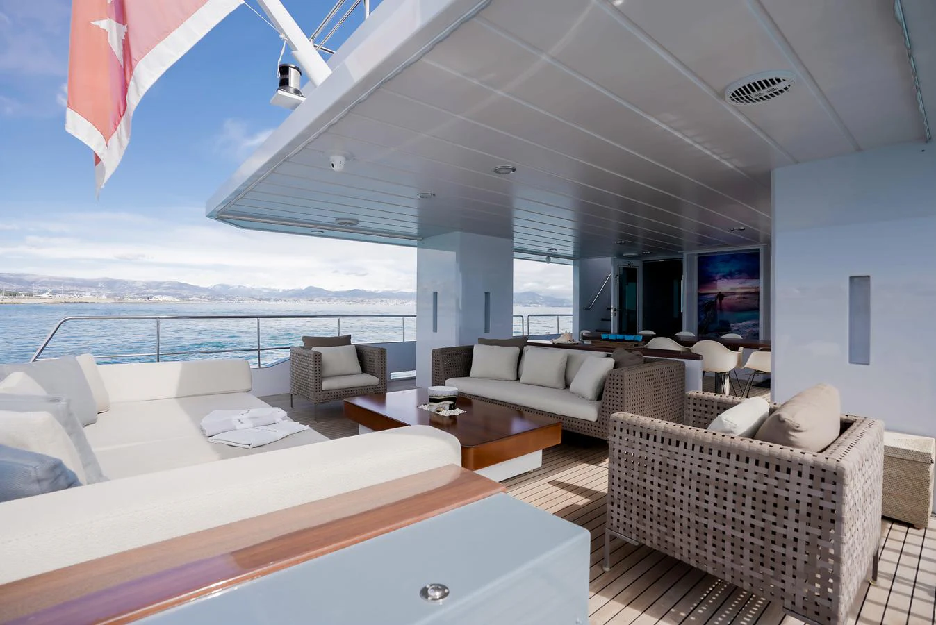 The aft deck offers a spacious and comfortable outdoor seating area with stunning ocean views. aboard ONLY NOW Yacht for Sale