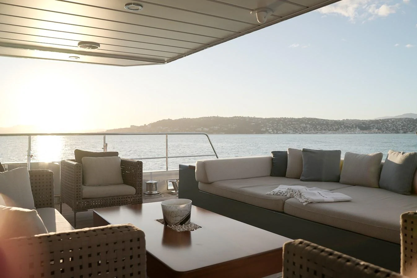 The aft deck offers a serene lounging area with comfortable seating and stunning views of the water. aboard ONLY NOW Yacht for Sale