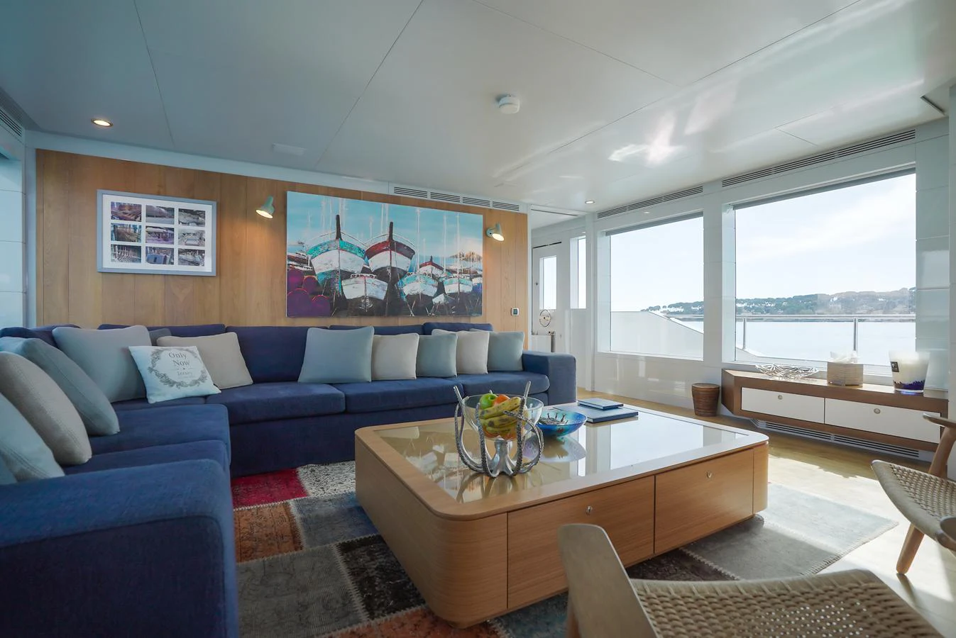 The salon offers a spacious and comfortable seating area with panoramic views. aboard ONLY NOW Yacht for Sale