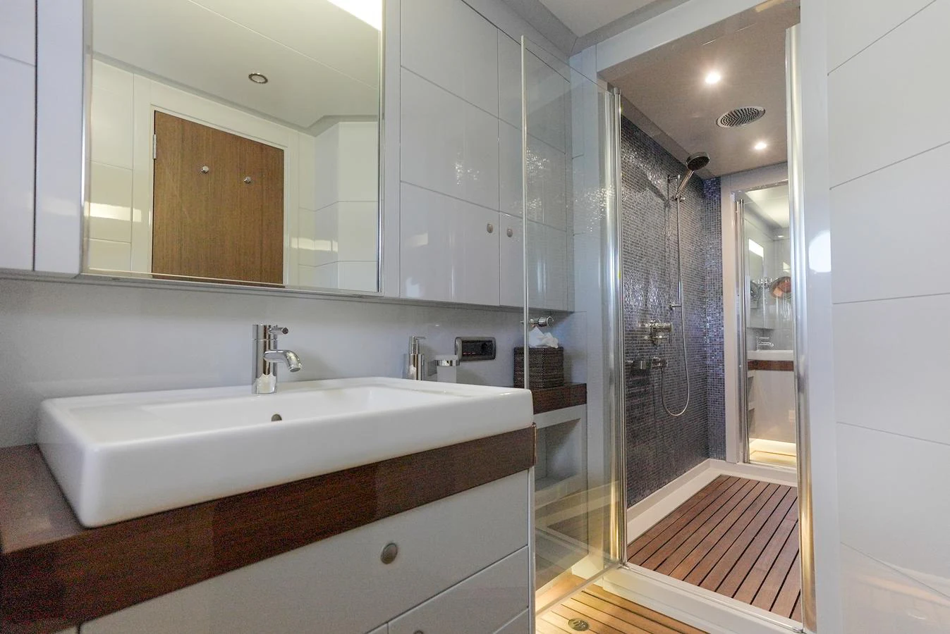 The yacht's bathroom features a sleek design with modern fixtures and a spacious shower area. aboard ONLY NOW Yacht for Sale