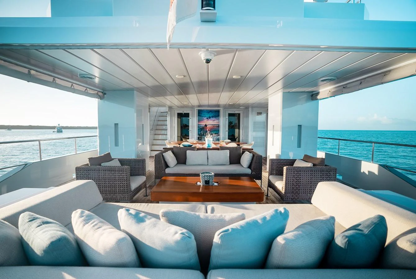 The aft deck offers a luxurious and comfortable seating area with stunning ocean views. aboard ONLY NOW Yacht for Sale