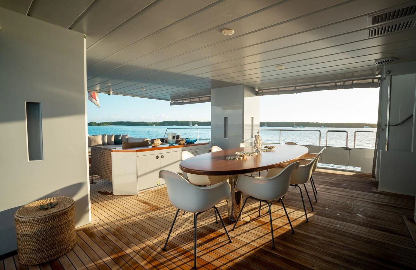 The aft deck features a stylish dining area with a beautiful view of the water. aboard ONLY NOW Yacht for Sale