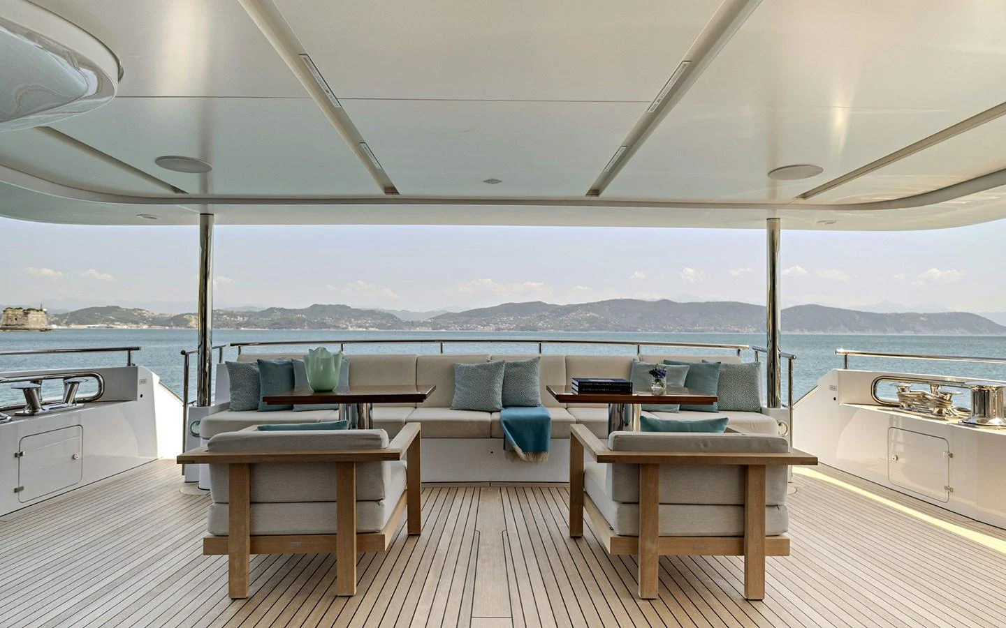 The aft deck offers a spacious and comfortable seating area with stunning views of the sea. aboard NECHIDA Yacht for Sale
