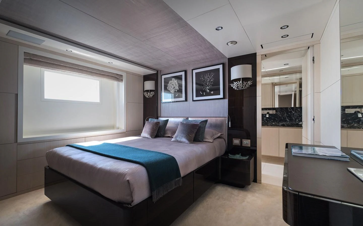 A luxurious stateroom featuring a large bed, modern decor, and ample natural light. aboard NECHIDA Yacht for Sale