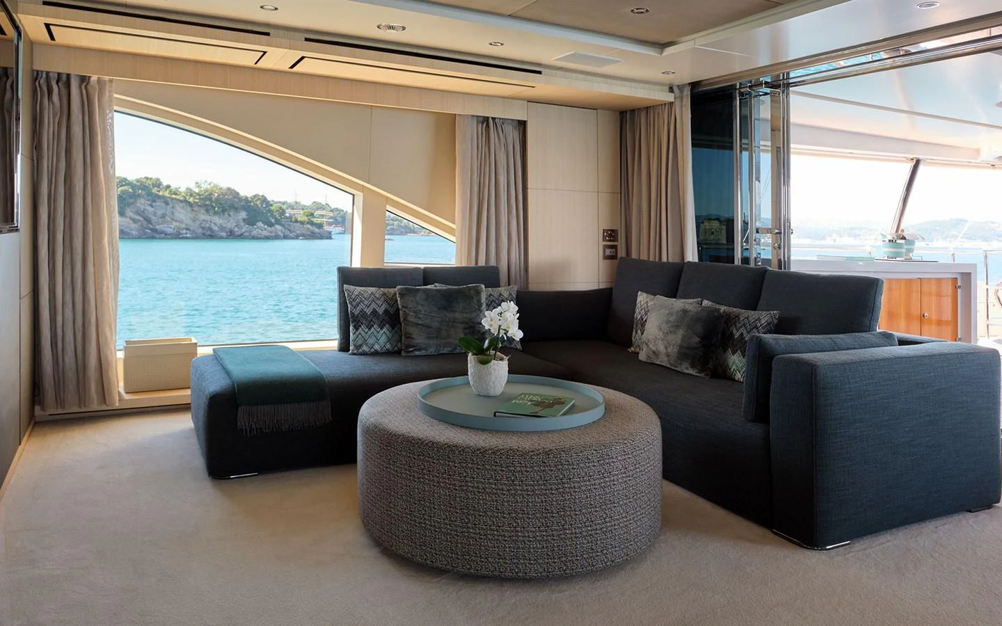 The salon features a comfortable seating area with panoramic views of the sea. aboard NECHIDA Yacht for Sale