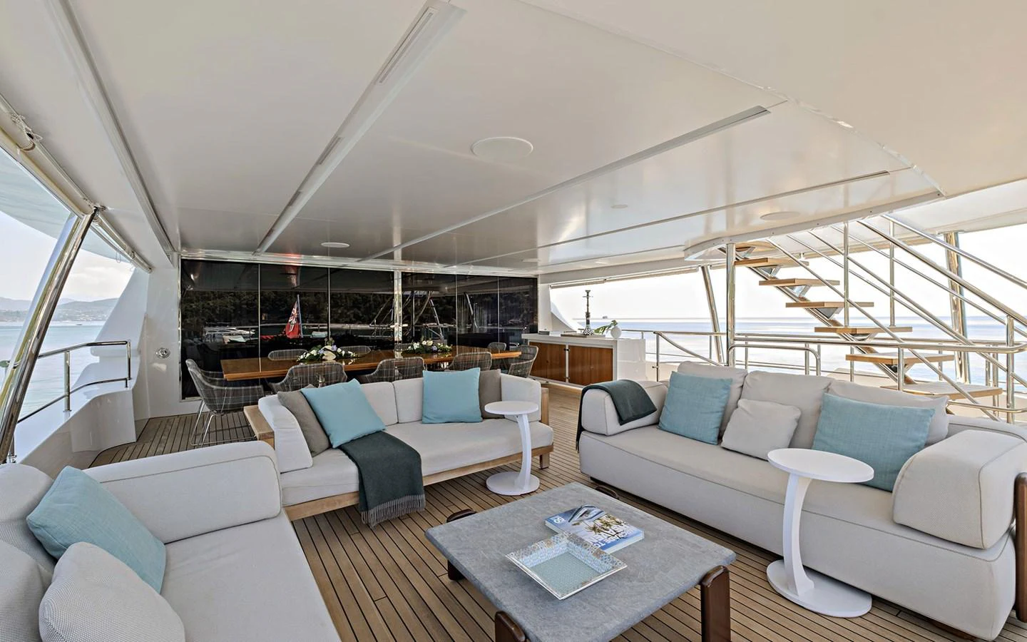 The spacious salon features comfortable seating with a modern, open layout and panoramic views. aboard NECHIDA Yacht for Sale
