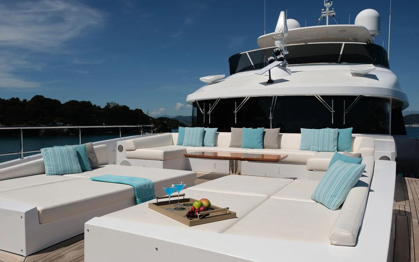 The sundeck features luxurious lounging areas with plush cushions and a serene ambiance. aboard NECHIDA Yacht for Sale
