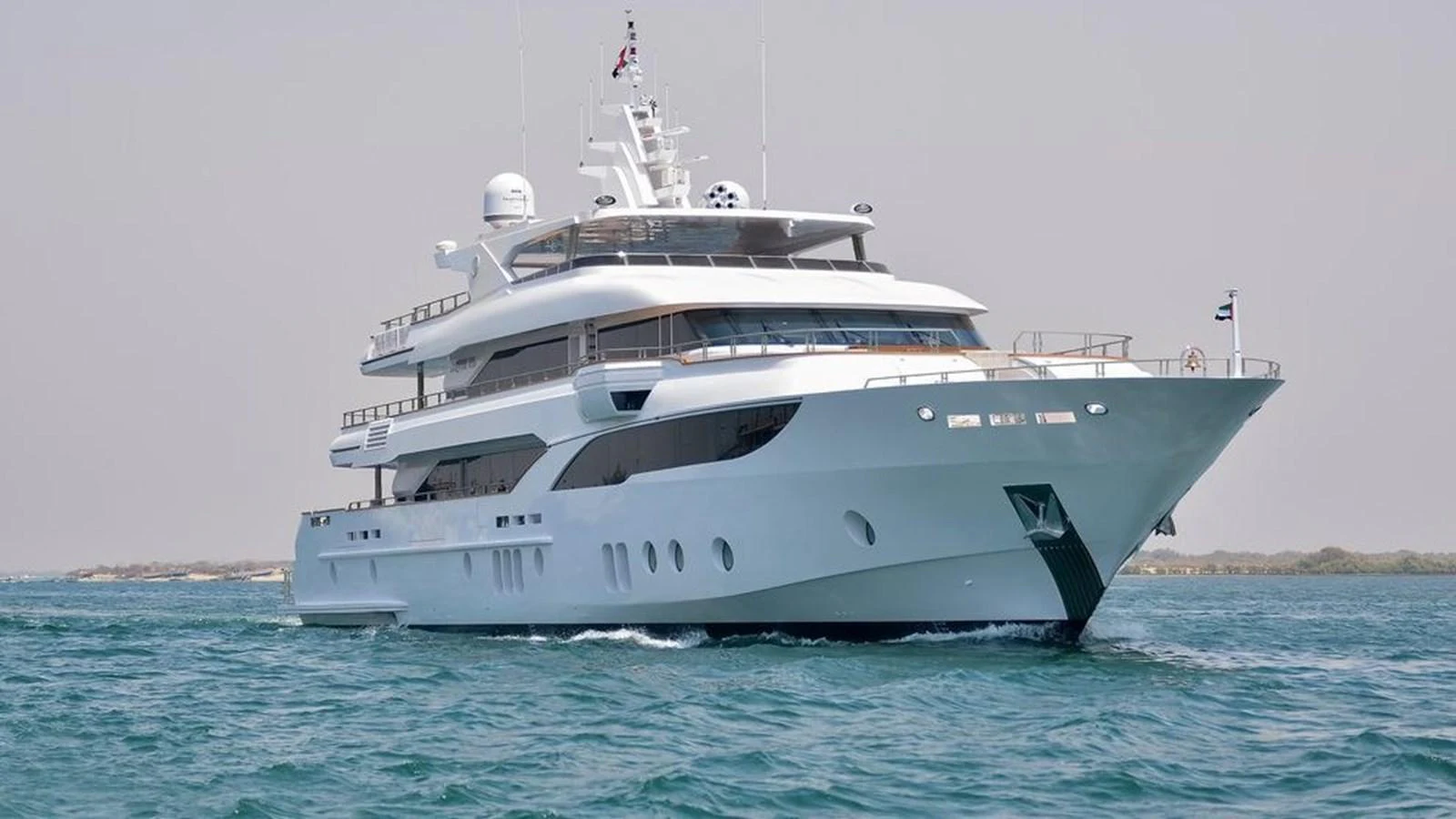 A luxurious yacht glides through the water, showcasing its sleek design and modern amenities. aboard ATLANTIS Yacht for Sale