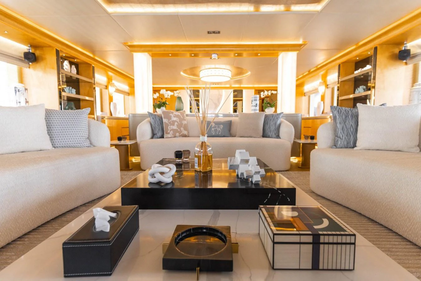 The salon features plush seating and elegant decor, creating a luxurious and inviting atmosphere. aboard ATLANTIS Yacht for Sale