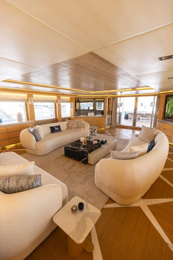 The salon features plush seating and elegant decor, creating a luxurious and inviting atmosphere. aboard ATLANTIS Yacht for Sale