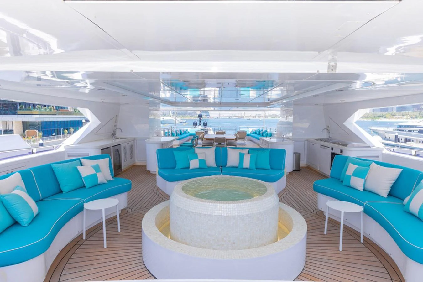 The sundeck features luxurious seating and a central jacuzzi, perfect for relaxation and entertainment. aboard ATLANTIS Yacht for Sale