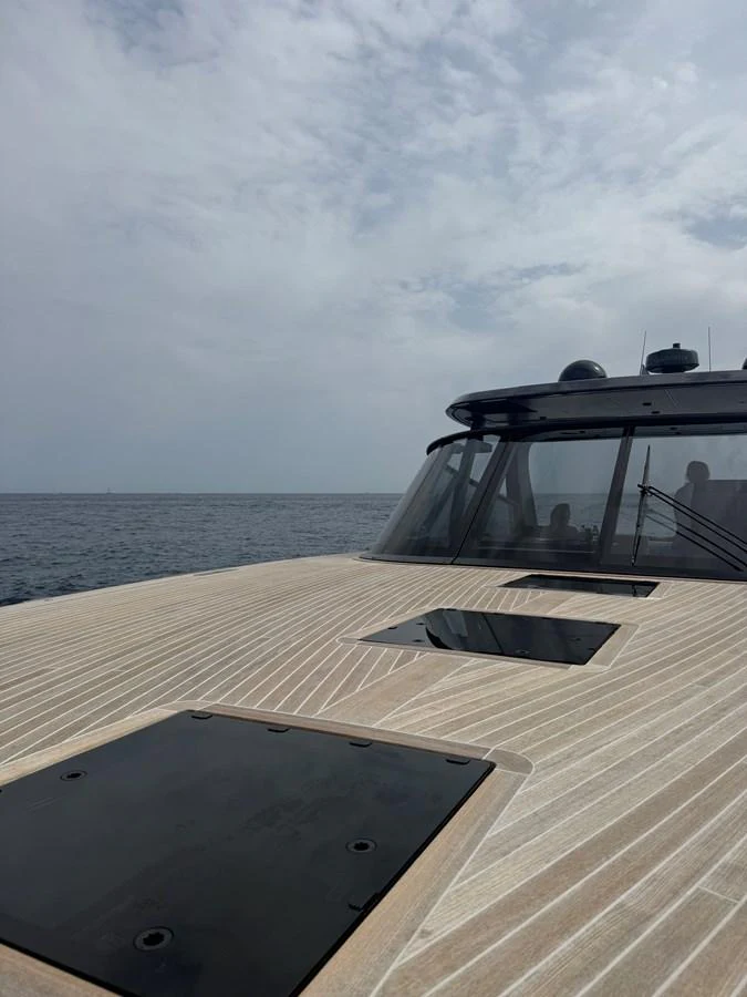 The yacht's deck showcases sleek lines and modern design against a serene ocean backdrop. aboard DUTCH PEARL Yacht for Sale