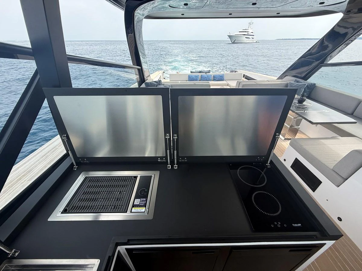 This outdoor galley offers a sleek and modern cooking space with a stunning ocean view. aboard DUTCH PEARL Yacht for Sale