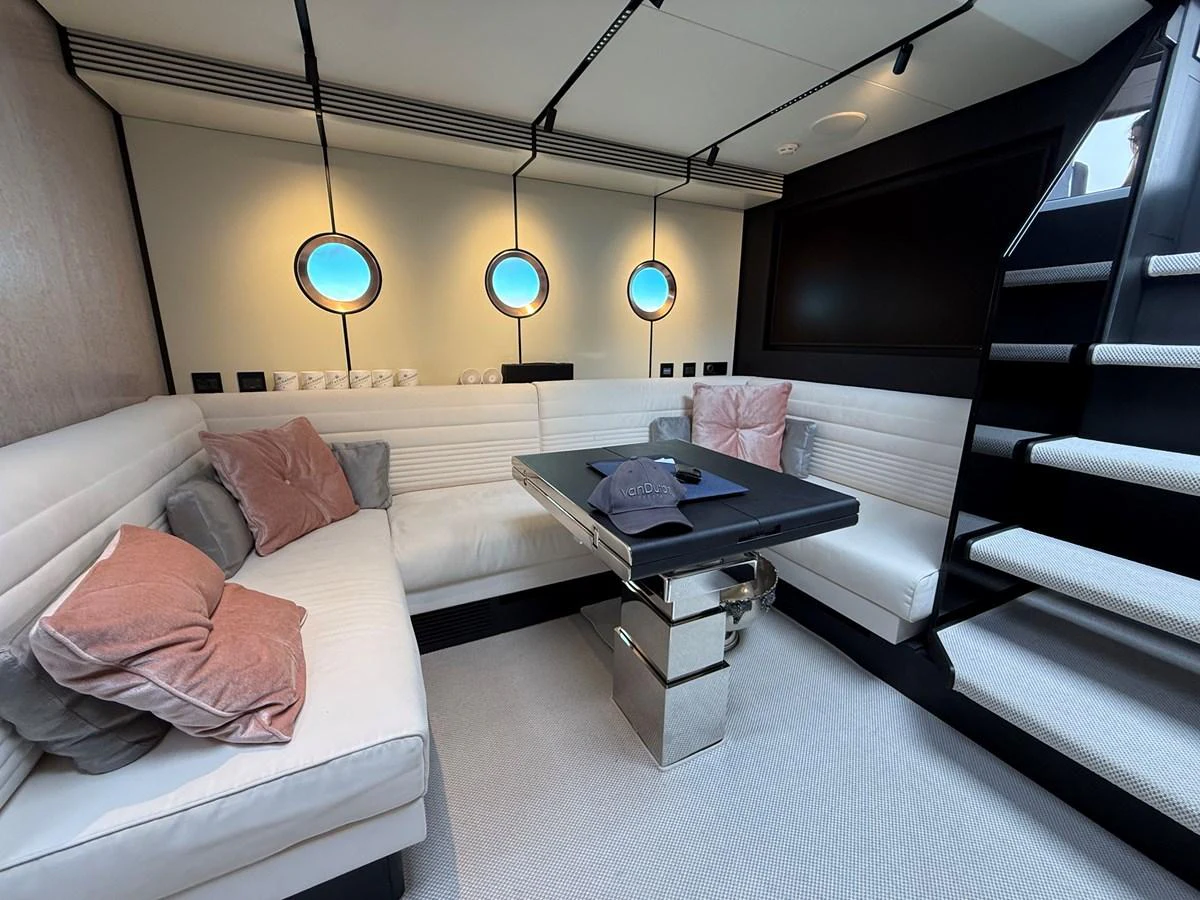 A stylish and cozy interior lounge area with plush seating and modern decor. aboard DUTCH PEARL Yacht for Sale