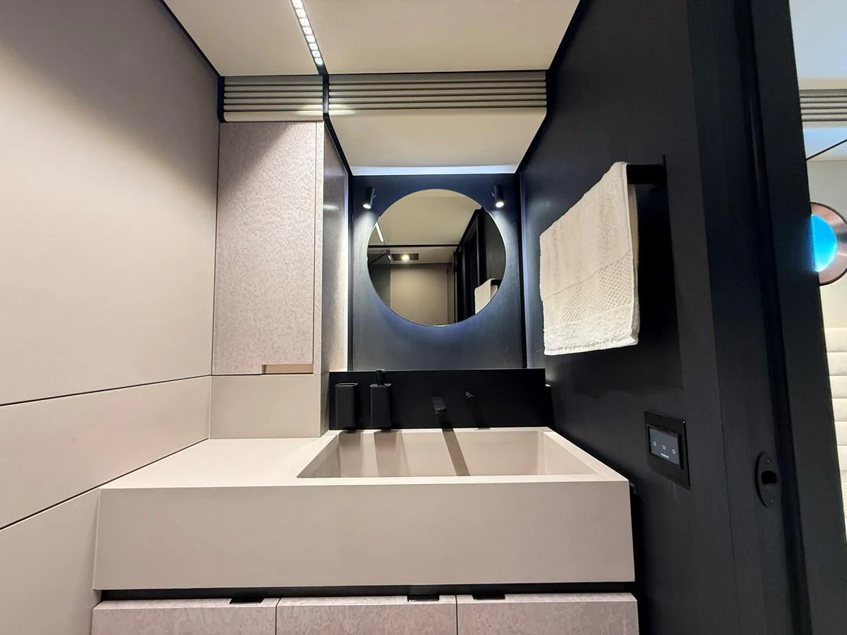 A sleek and modern yacht bathroom with minimalist design and high-end fixtures. aboard DUTCH PEARL Yacht for Sale