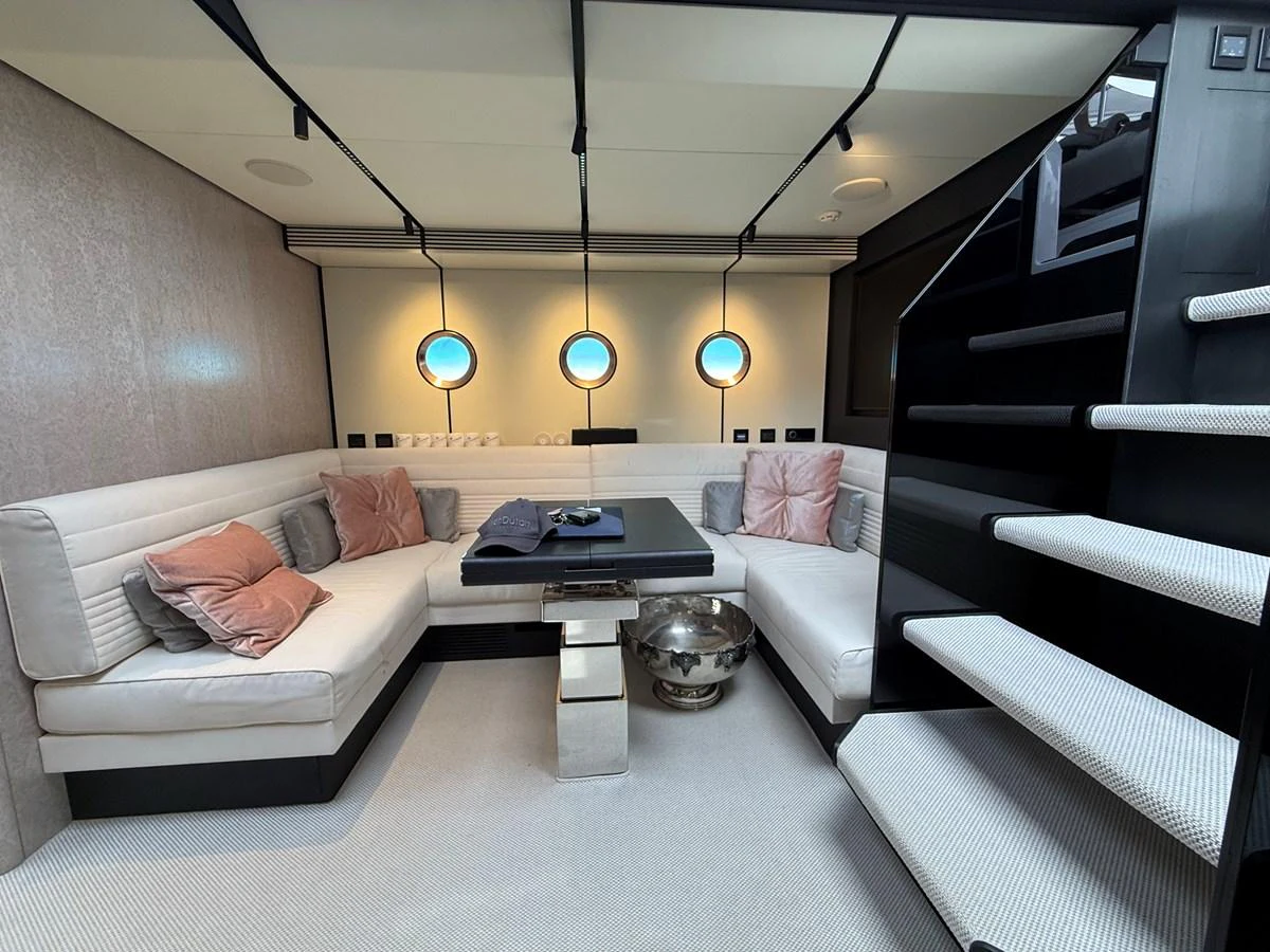 The salon features a cozy seating area with plush cushions and modern decor. aboard DUTCH PEARL Yacht for Sale
