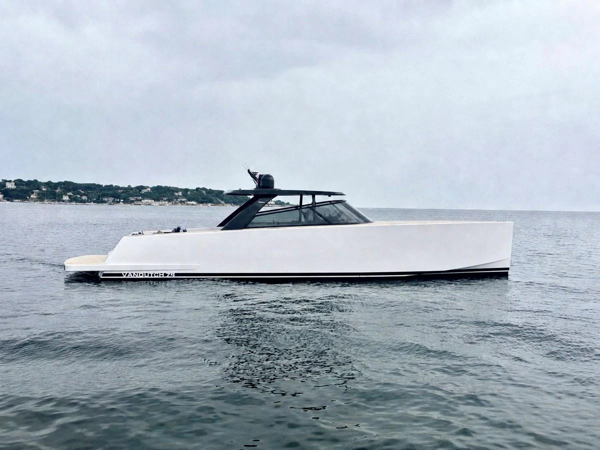 A sleek, modern yacht glides gracefully on calm waters, showcasing its elegant profile. aboard DUTCH PEARL Yacht for Sale
