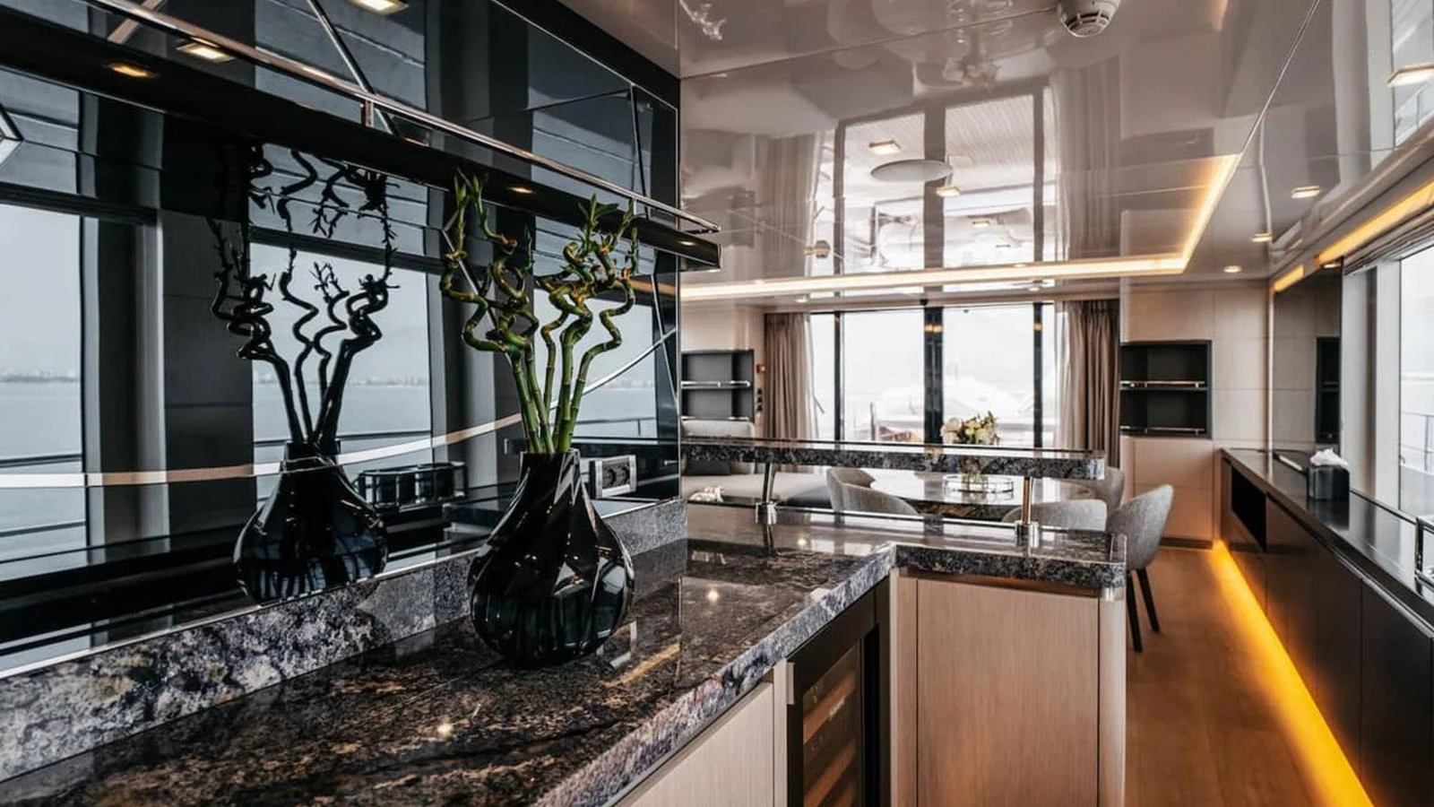 The yacht's galley features sleek, modern design with high-end finishes and ample natural light. aboard HEEUS Yacht for Sale