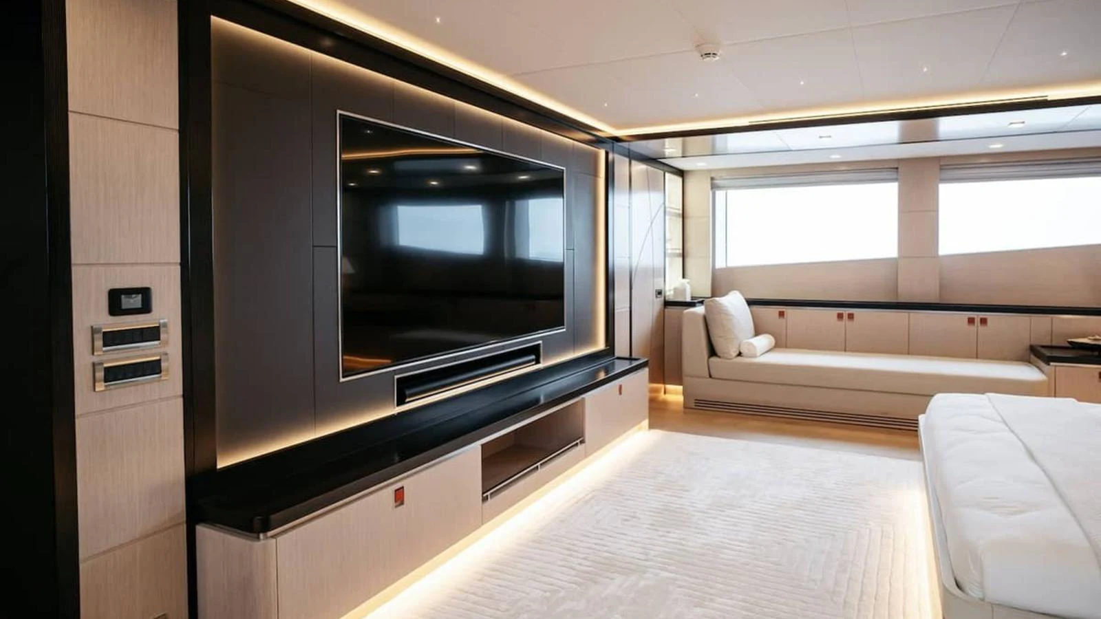 The yacht's salon features a large flat-screen TV, a comfortable seating area, and modern decor. aboard HEEUS Yacht for Sale