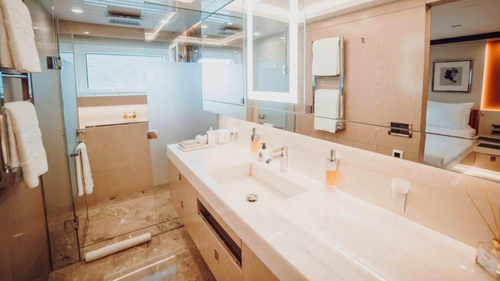 The yacht's bathroom features a luxurious and modern design with ample counter space and elegant fixtures. aboard HEEUS Yacht for Sale