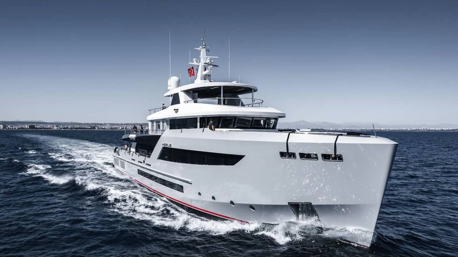 A sleek and modern yacht cruises through the open water, showcasing its impressive design and engineering. aboard HEEUS Yacht for Sale
