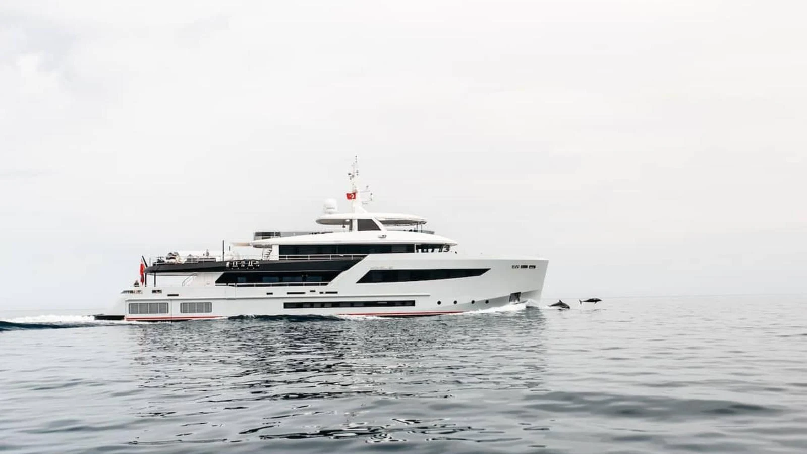 A sleek and modern yacht cruises smoothly on calm waters, showcasing its elegant design. aboard HEEUS Yacht for Sale