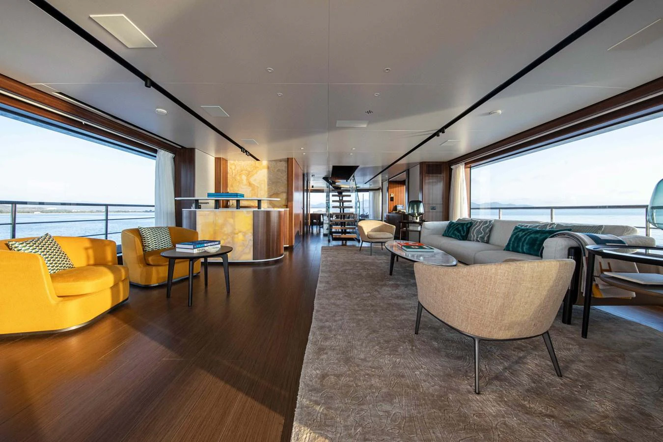 The spacious salon features elegant seating areas with panoramic views. aboard JULES Yacht for Sale