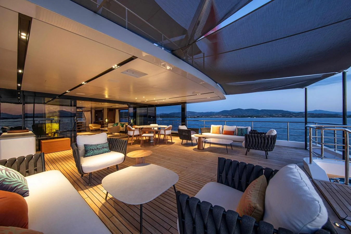 The aft deck offers a spacious and luxurious outdoor living area with comfortable seating and stunning views. aboard JULES Yacht for Sale