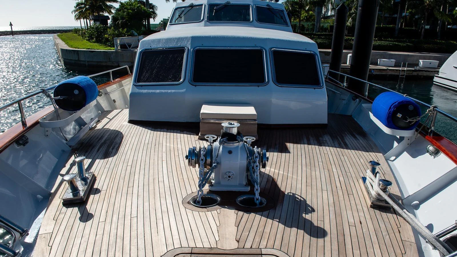 The foredeck features a spacious layout with a clean, well-maintained teak deck and essential equipment. aboard SISISI Yacht for Sale