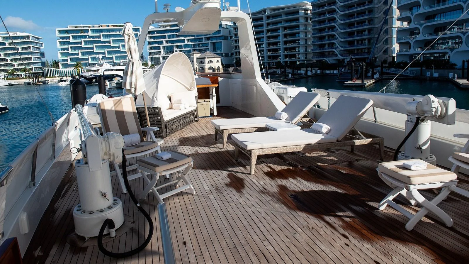 The sundeck offers a luxurious space with sun loungers and seating, perfect for relaxation. aboard SISISI Yacht for Sale