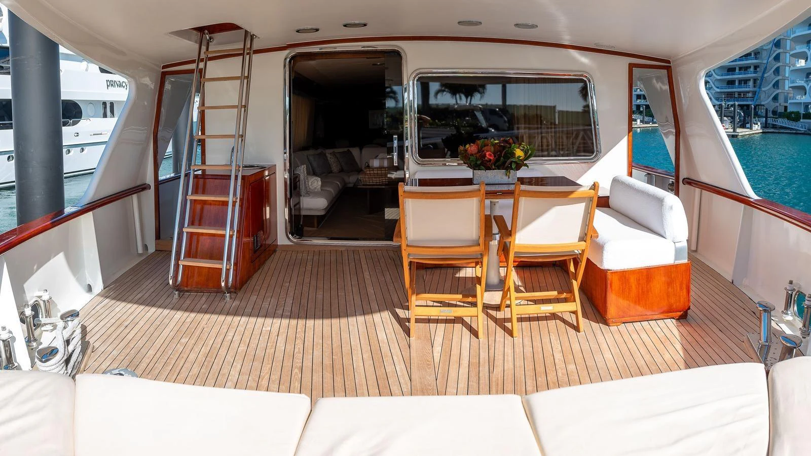 The aft deck offers a spacious and inviting area for relaxation and dining with a view of the marina. aboard SISISI Yacht for Sale