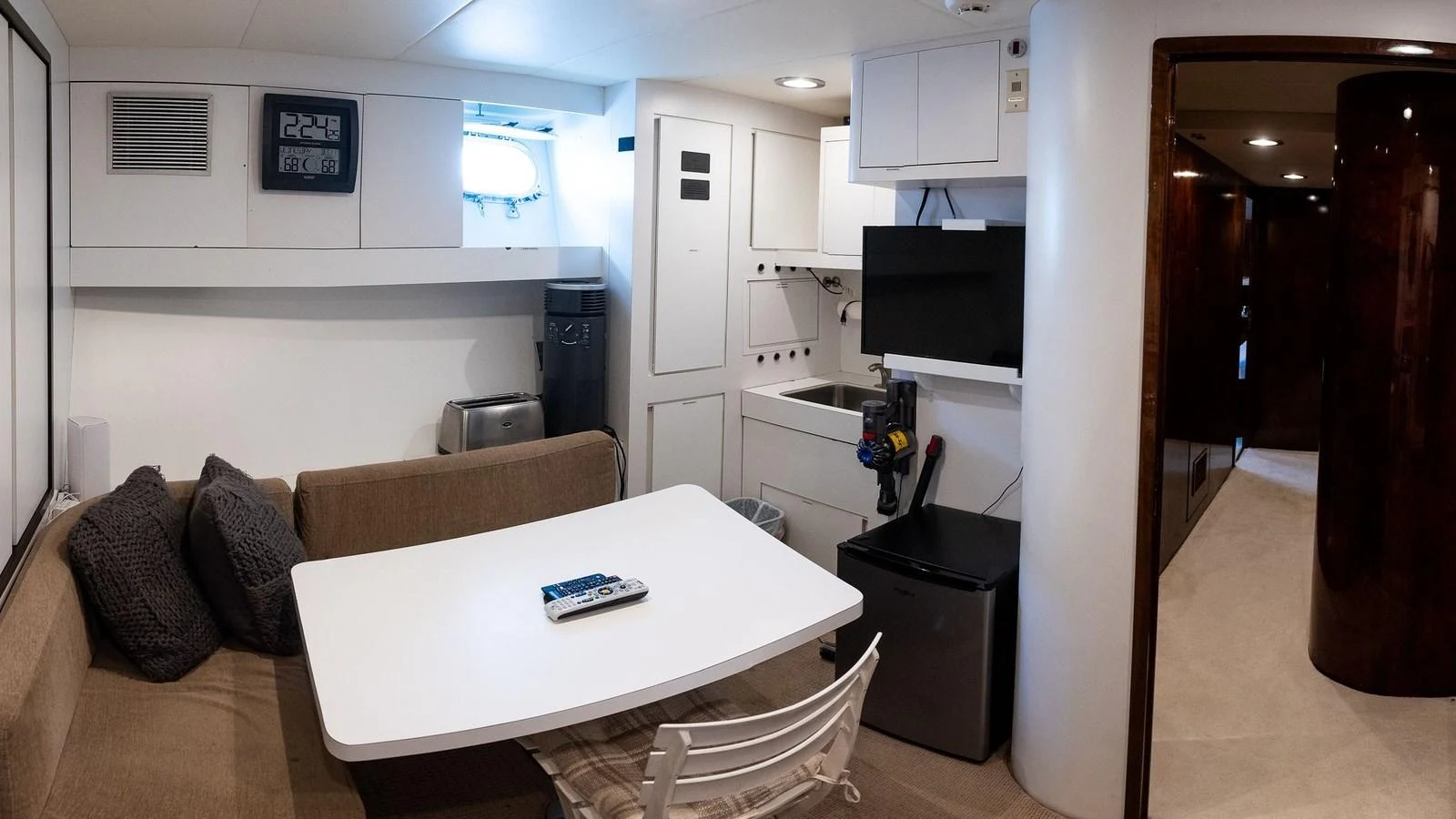 The galley features a cozy dining area with modern amenities and ample storage. aboard SISISI Yacht for Sale