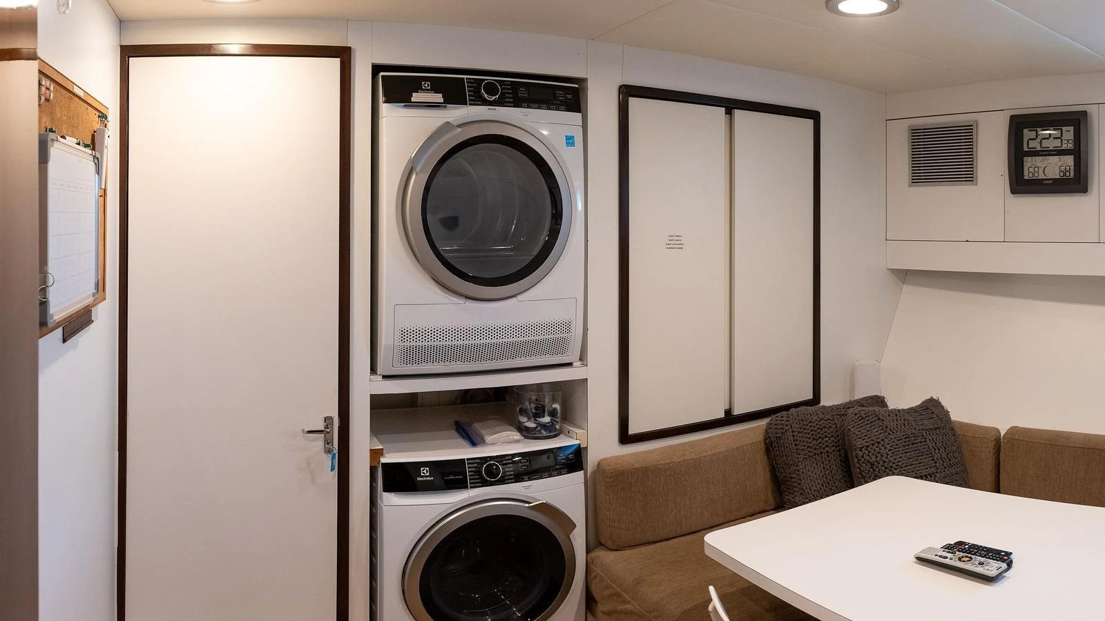 The yacht's laundry room features modern appliances and a cozy seating area. aboard SISISI Yacht for Sale