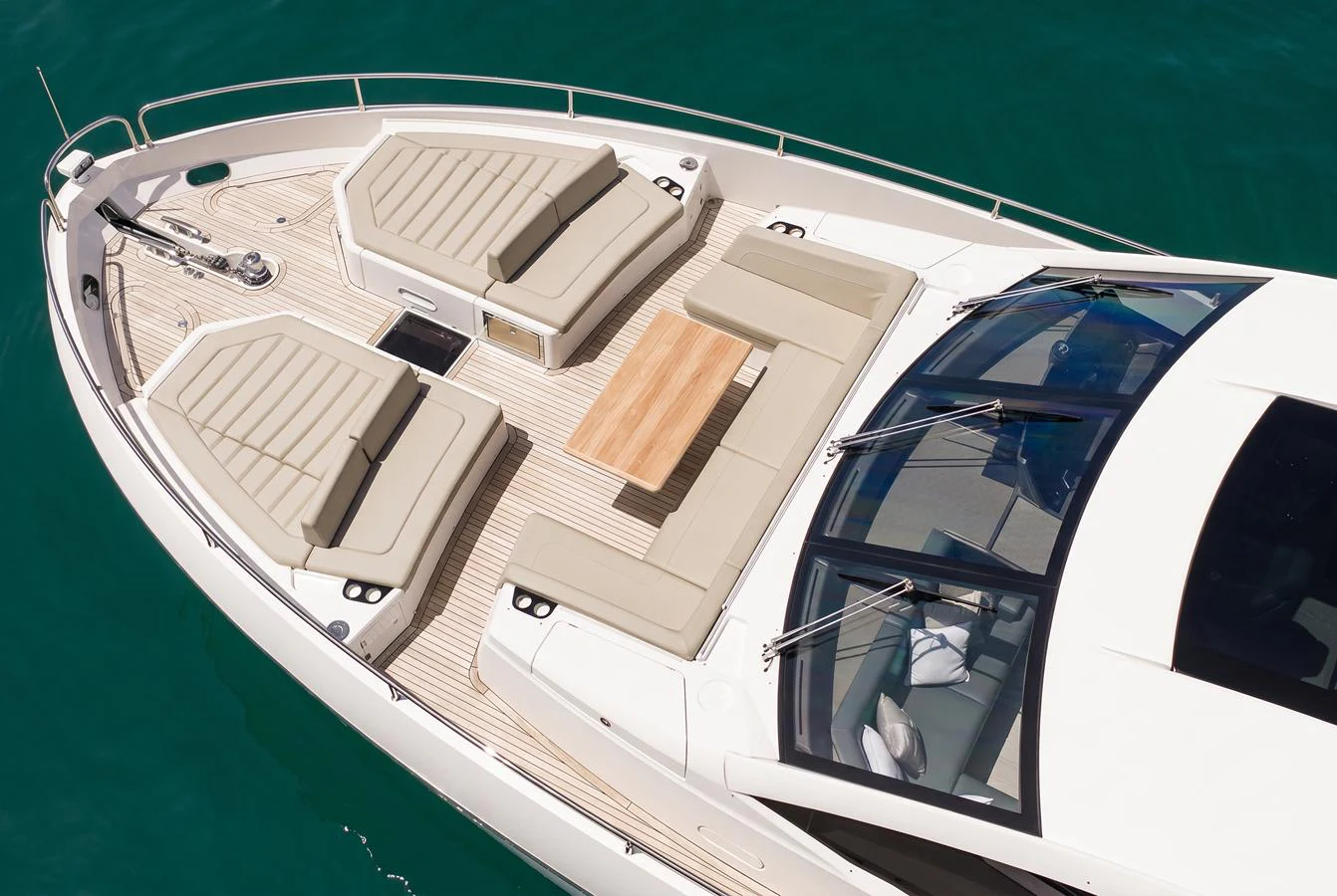 The foredeck features luxurious sunpads and a stylish dining area, perfect for relaxation and socializing. aboard BAZINGA Yacht for Sale