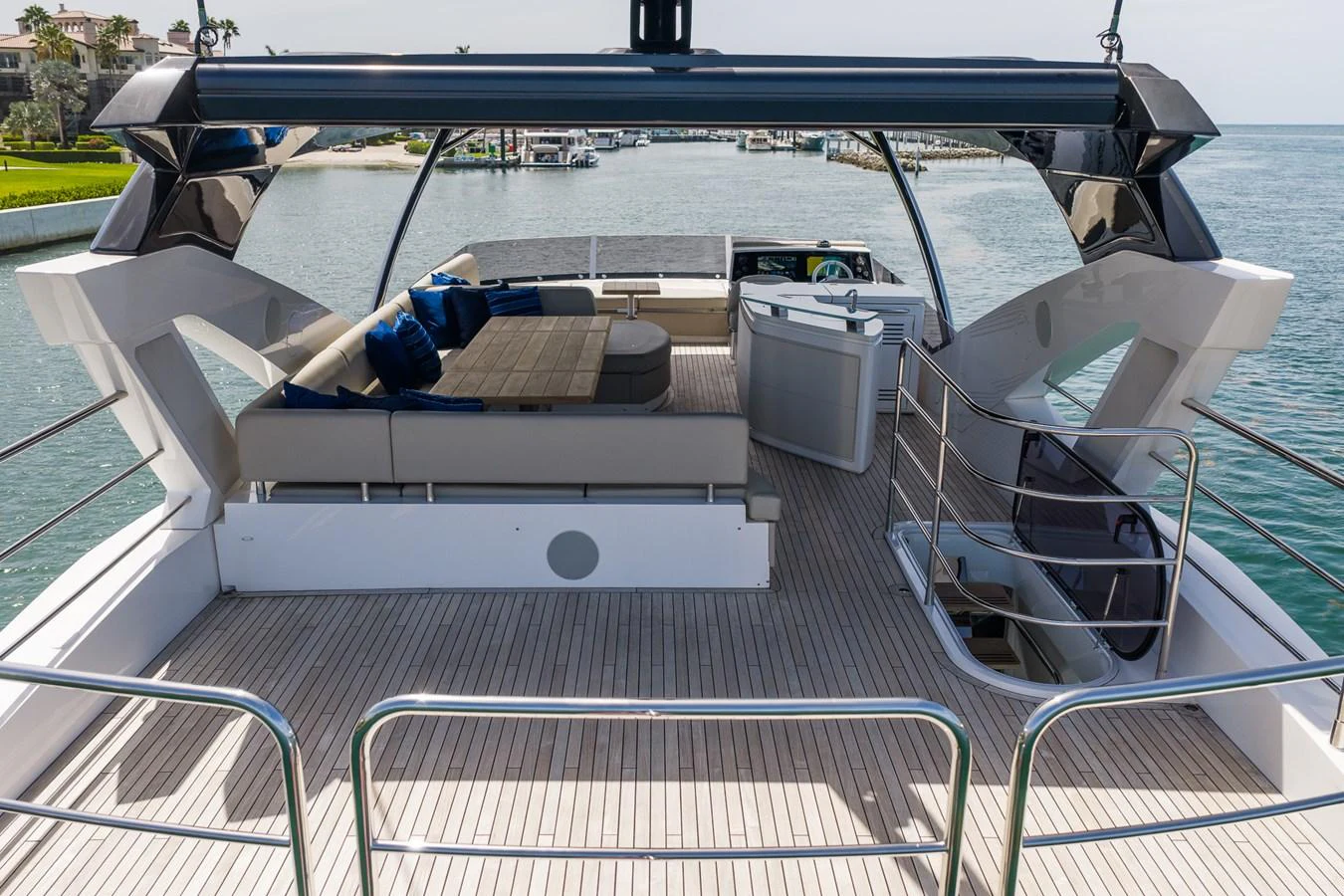 The flybridge offers a spacious lounging area with comfortable seating and a panoramic view of the surrounding waters. aboard BAZINGA Yacht for Sale