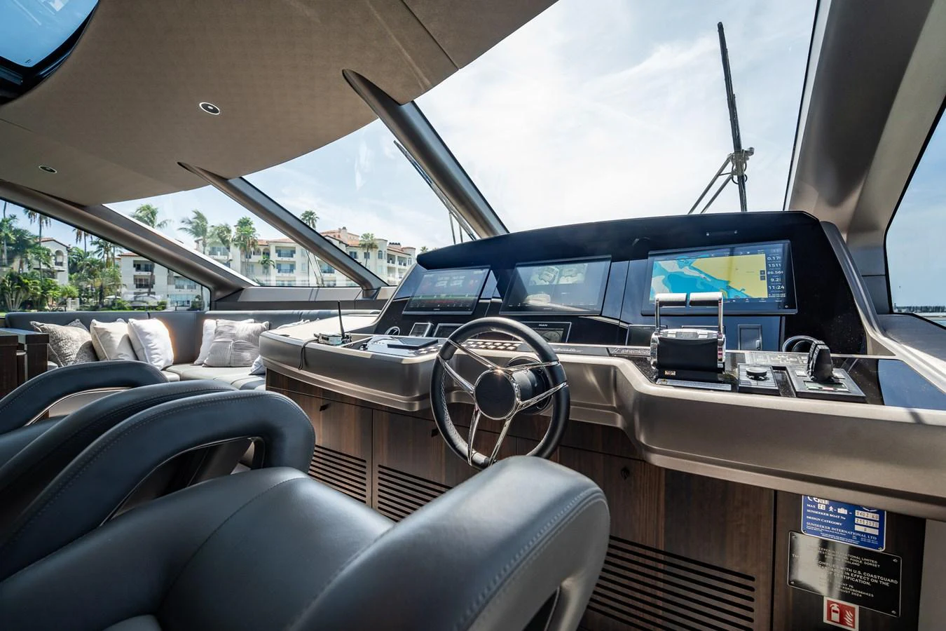 The helm station offers a commanding view with state-of-the-art navigation equipment and luxurious seating. aboard BAZINGA Yacht for Sale