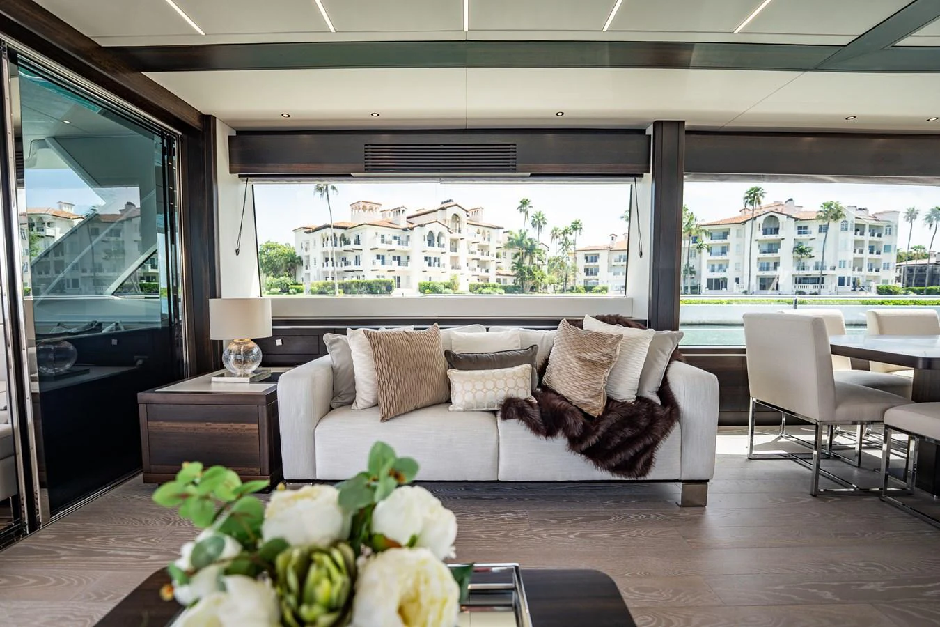 The salon offers a luxurious and comfortable seating area with large windows providing stunning views. aboard BAZINGA Yacht for Sale