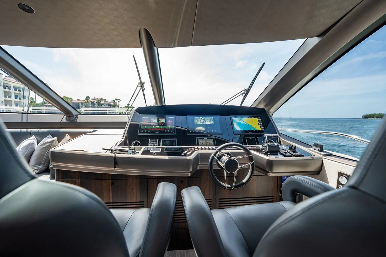 The helm station offers a commanding view with state-of-the-art navigation equipment and luxurious seating. aboard BAZINGA Yacht for Sale